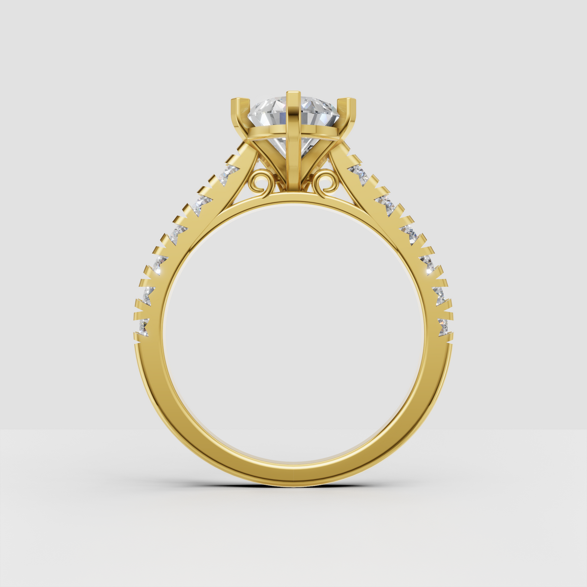 Side view of pear shaped diamond engagement ring with pavé shoulders and intricate decorative gallery.