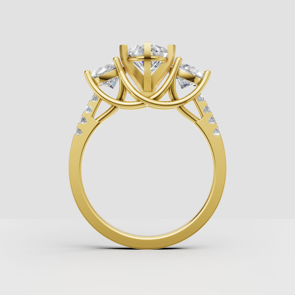 Pear cut diamond ring with round diamond side stones and yellow gold band