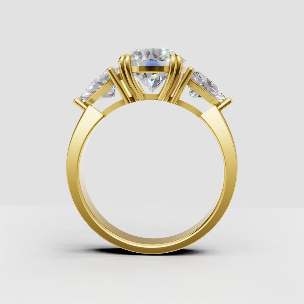 Gold round diamond ring featuring matching Trillion side stones
