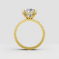 Round center stone ring with four sculpted prongs