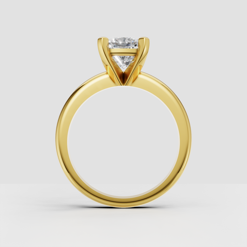 Cushion diamond solitaire ring with polished gold band
