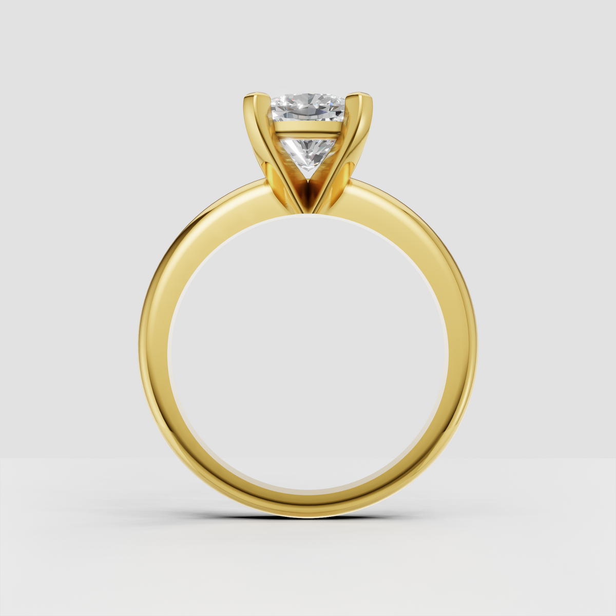 Cushion diamond solitaire ring with polished gold band