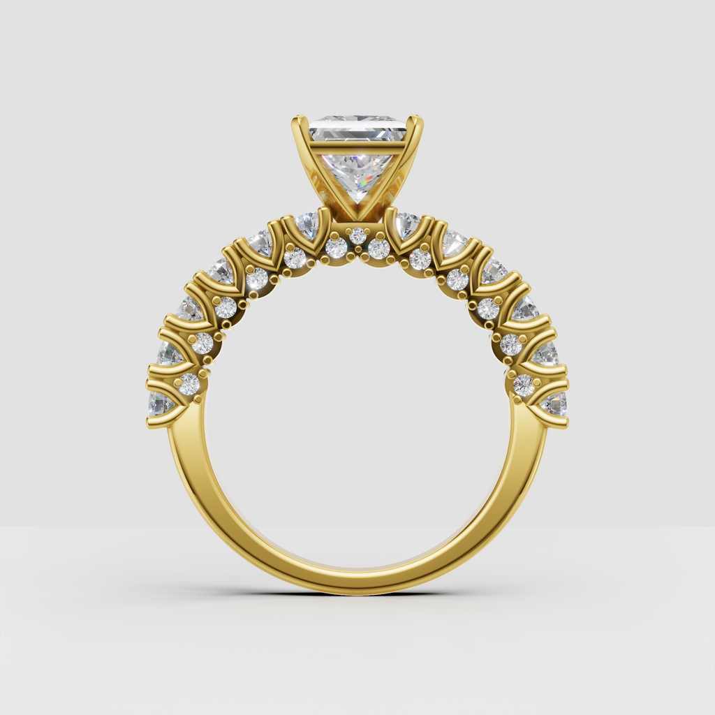 Princess diamond ring featuring a detailed yellow gold pavé band