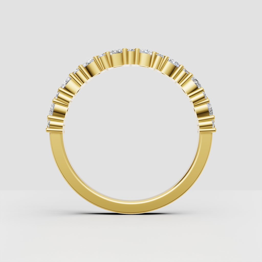 Elegant round and pear diamond wedding band in yellow gold
