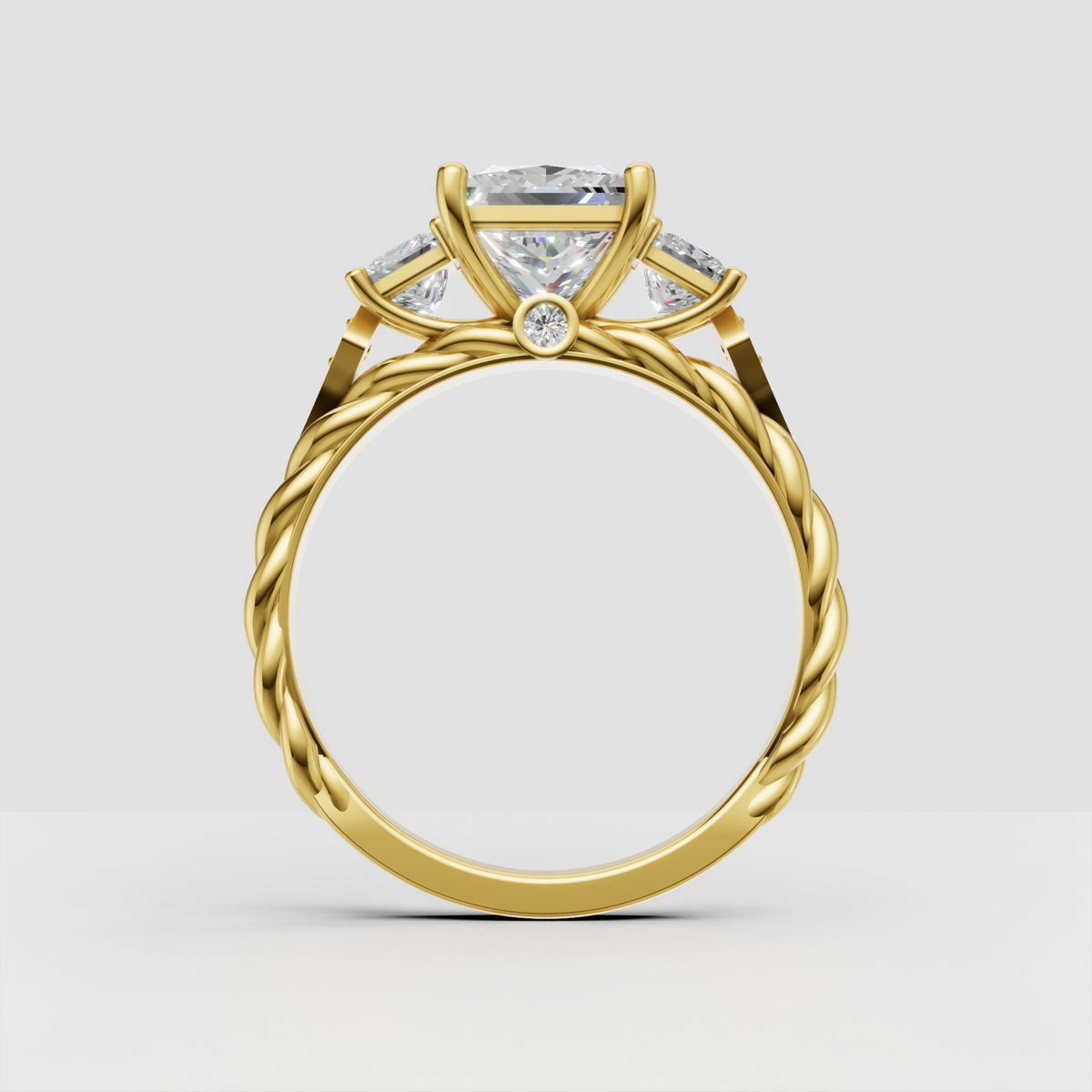 Princess diamond three stone ring featuring an ornate braided band