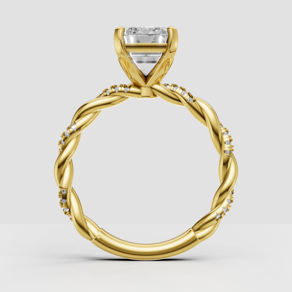 Emerald diamond ring featuring an elegant twisted rope-style shank