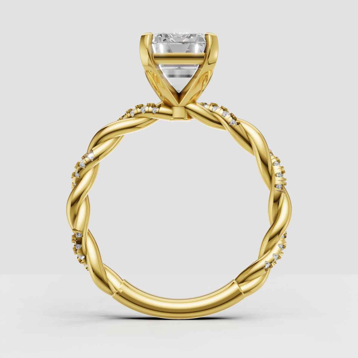 Emerald diamond ring featuring an elegant twisted rope-style shank