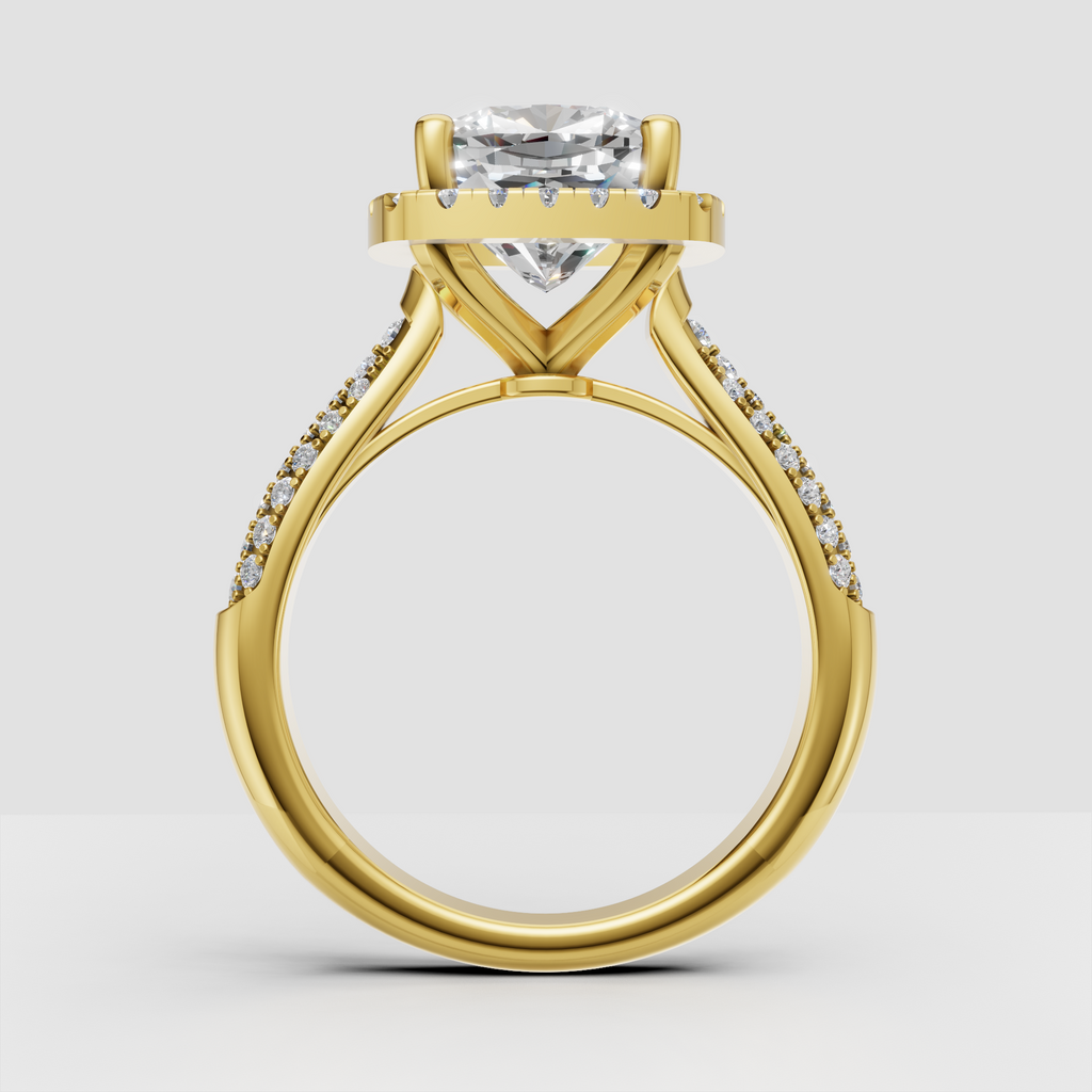 Cushion center stone engagement ring with four-prong setting