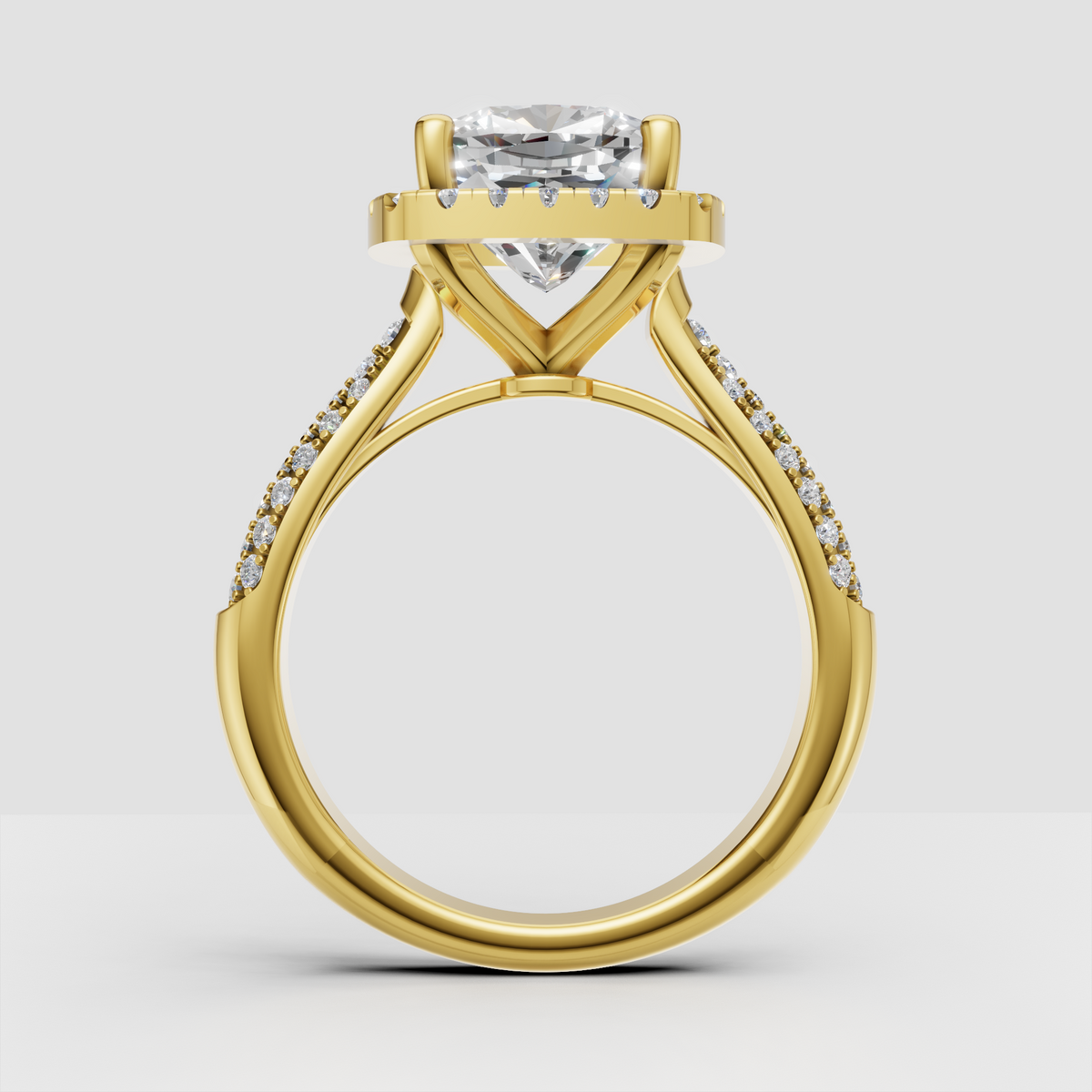 Cushion center stone engagement ring with four-prong setting