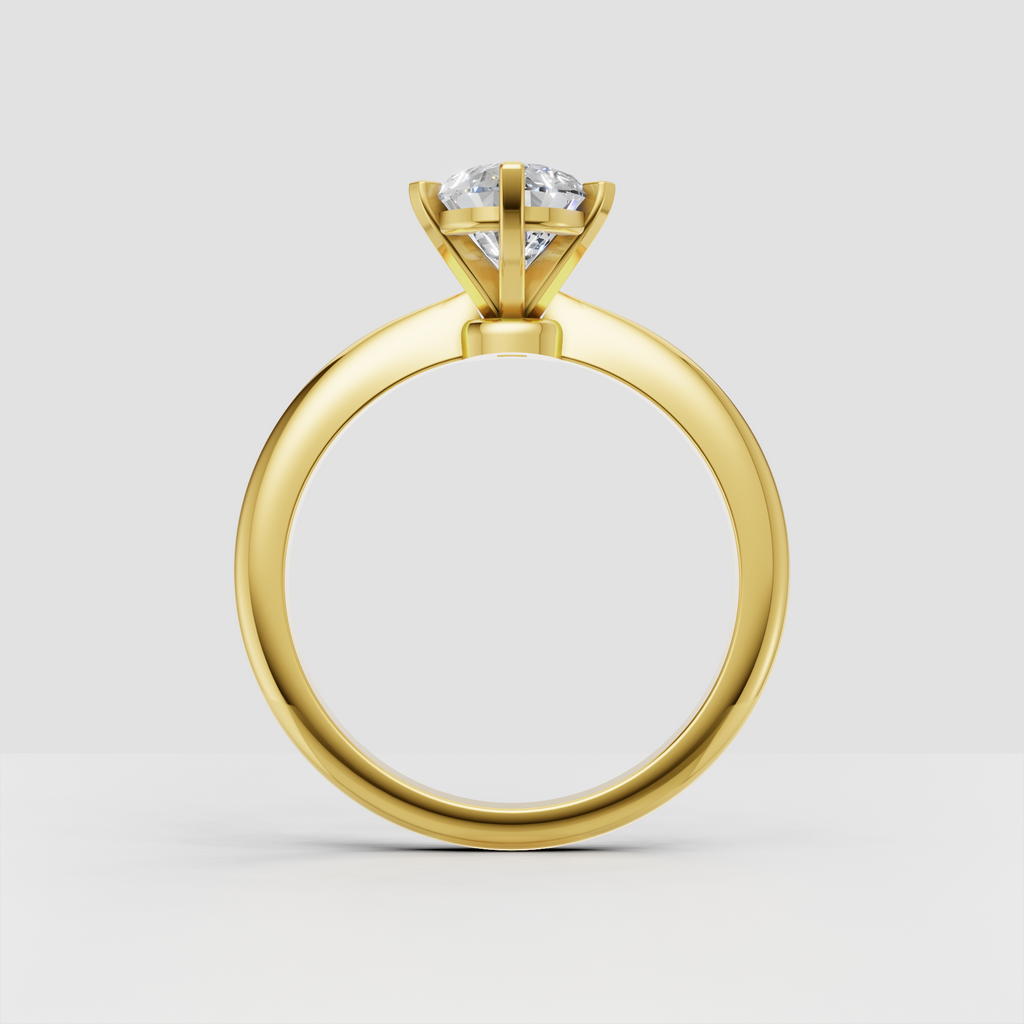 Cathedral-style pear diamond engagement ring with open gallery