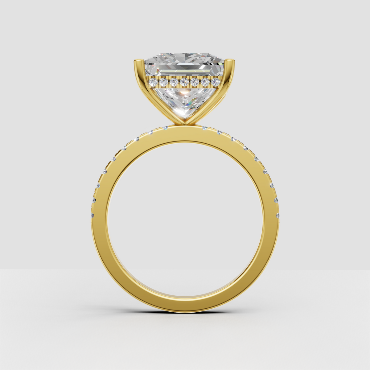 Luxury princess diamond hidden halo engagement ring with sparkling pavé shoulders.