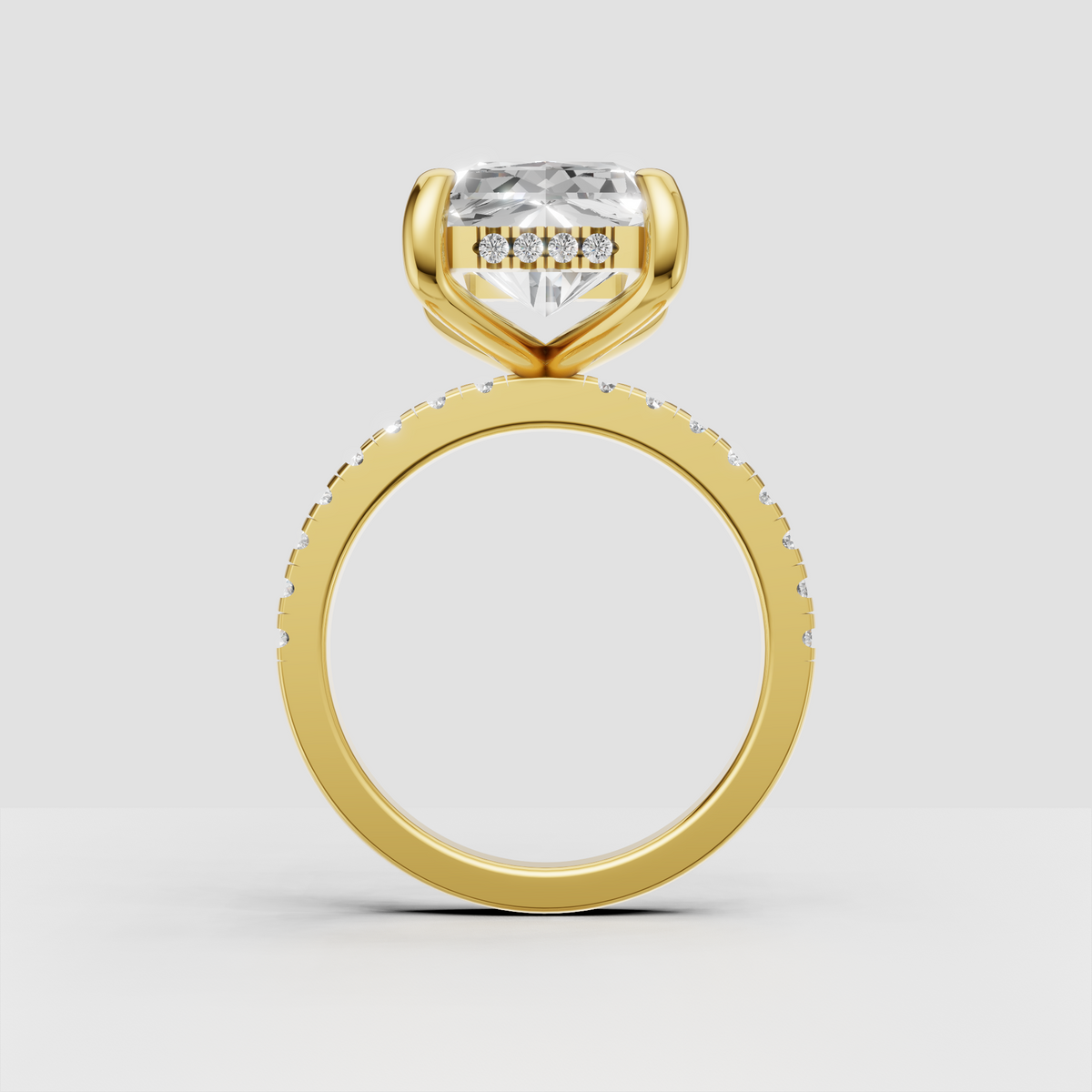 Yellow gold Radiant Diamond hidden halo engagement ring with pave-set shoulders