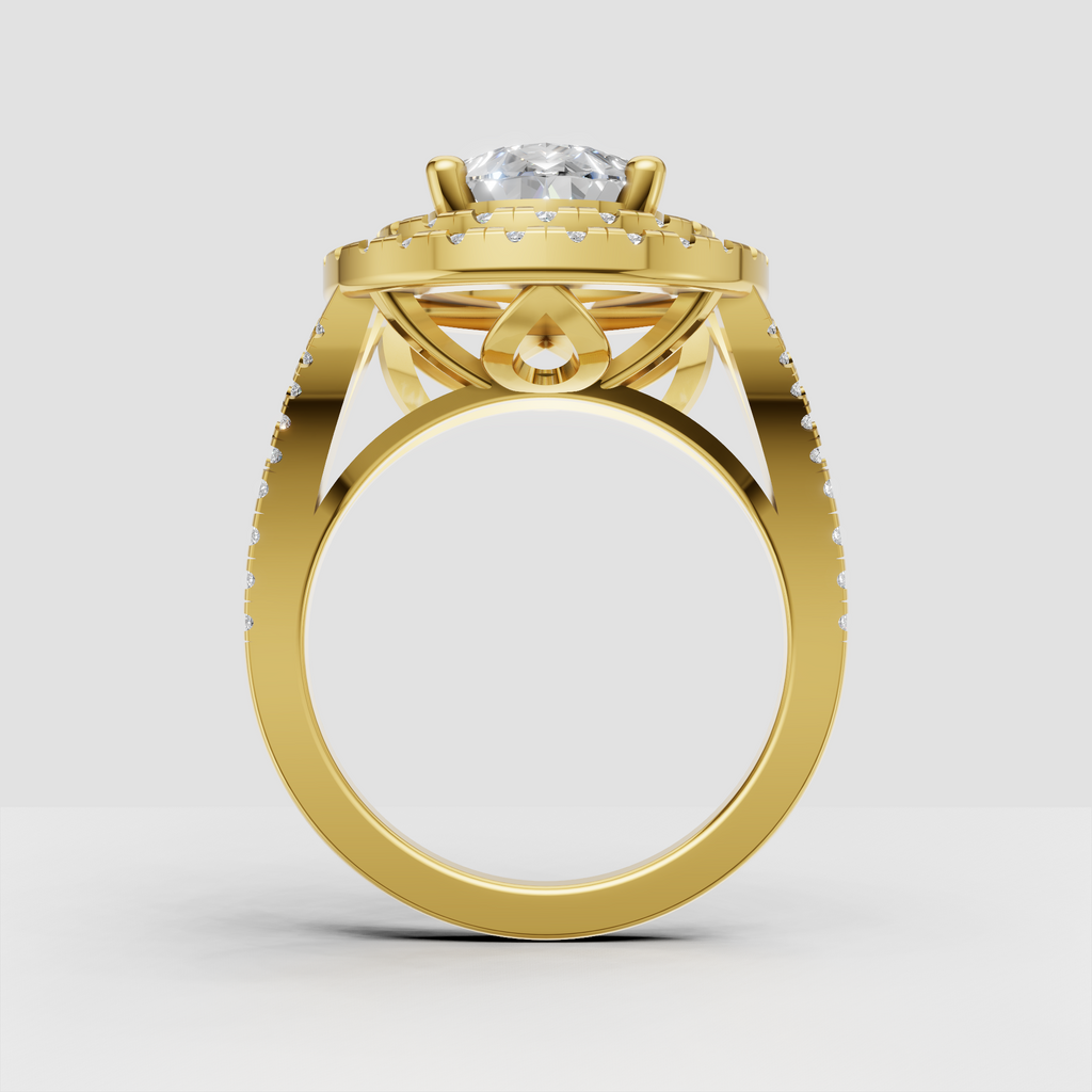 Yellow gold pear diamond engagement ring with pavé shoulders