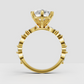 Pear diamond ring featuring alternating marquise and round stones