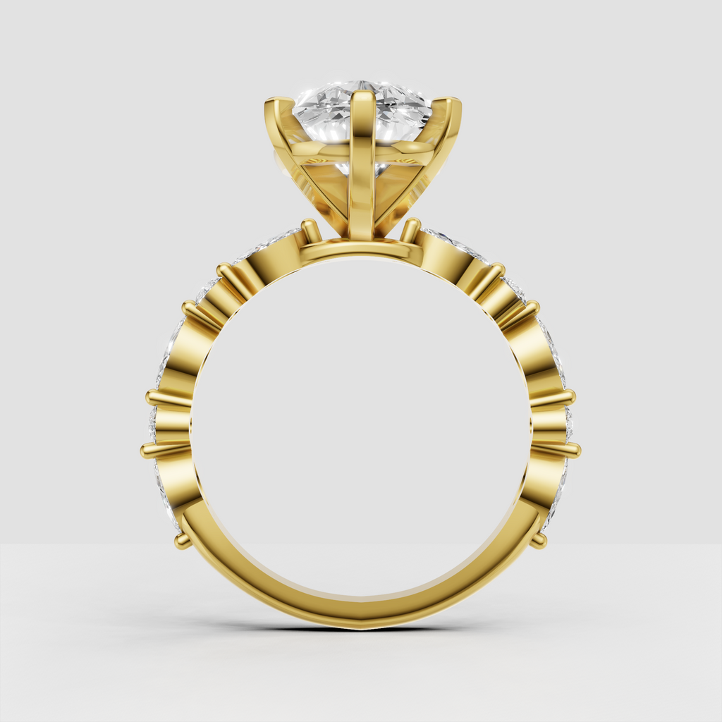 Pear diamond ring featuring alternating marquise and round stones