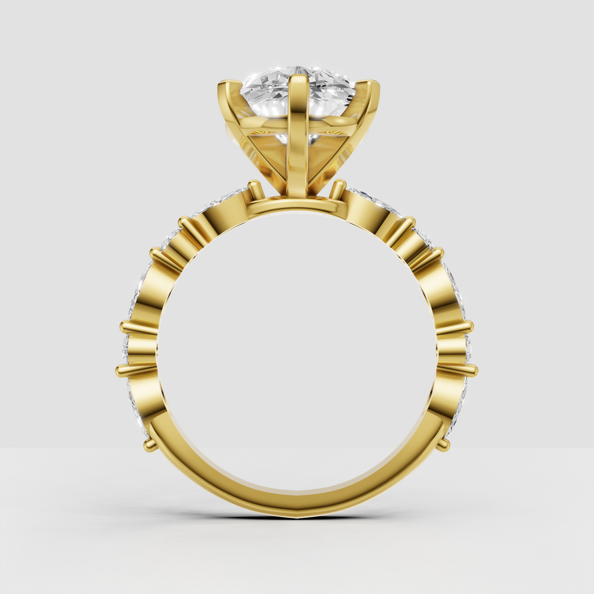 Pear diamond ring featuring alternating marquise and round stones