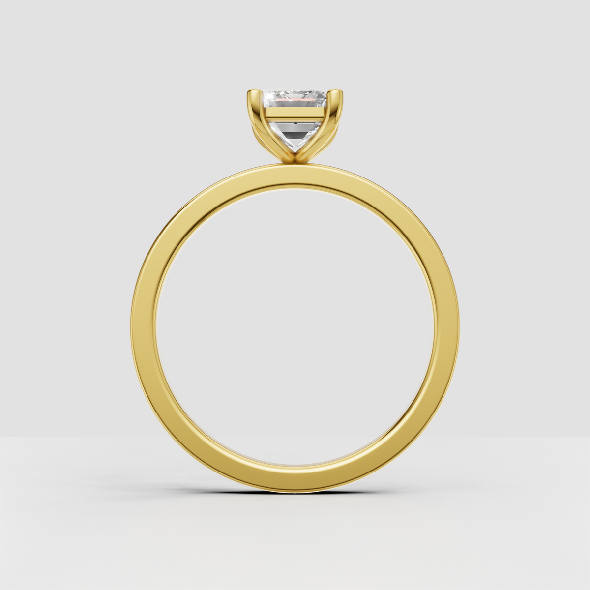 Emerald diamond engagement ring with cathedral shoulders