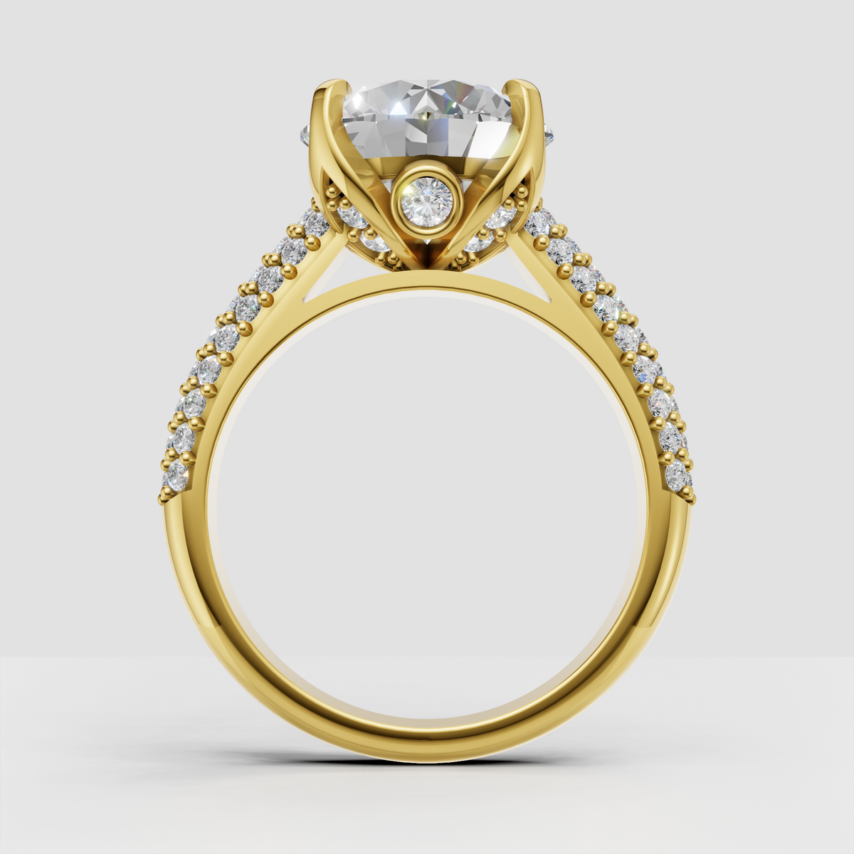 Round cut diamond ring featuring four-prong setting and pavé band