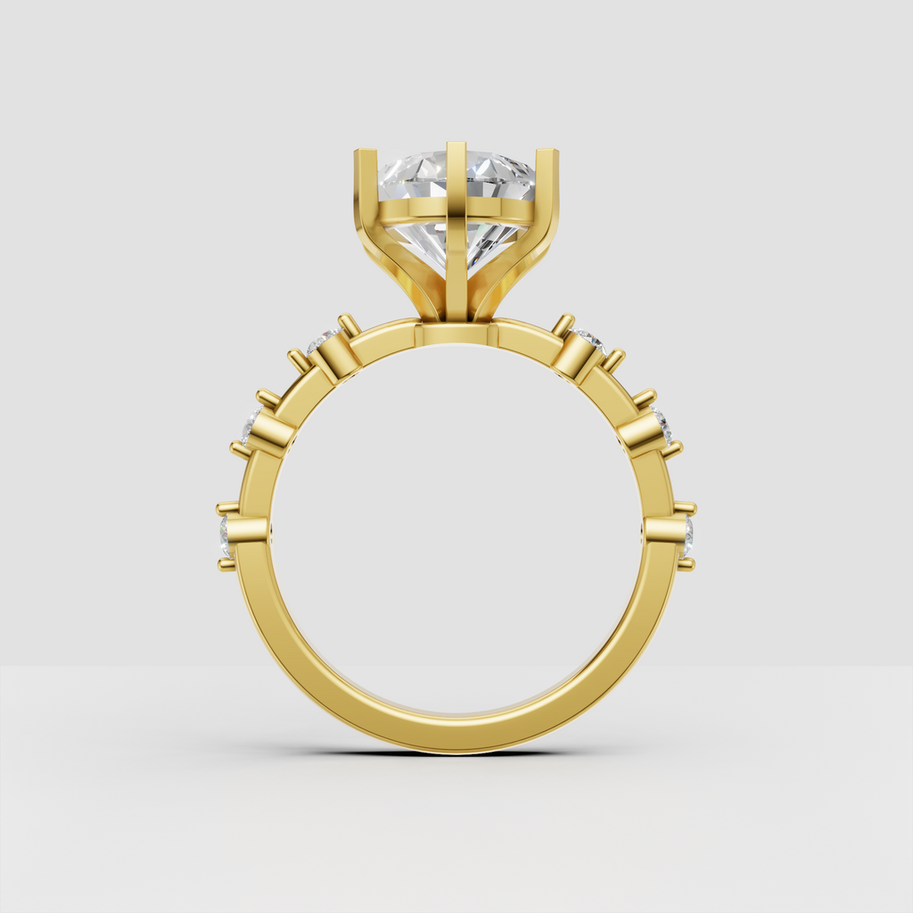 Yellow gold pear diamond ring with sparkling side stones