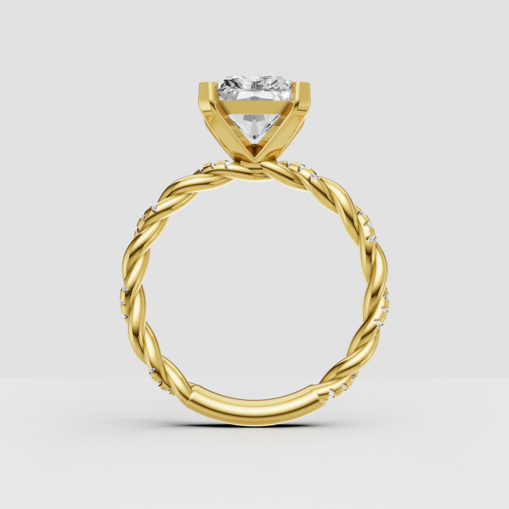Yellow gold radiant cut diamond ring with pavé shoulders