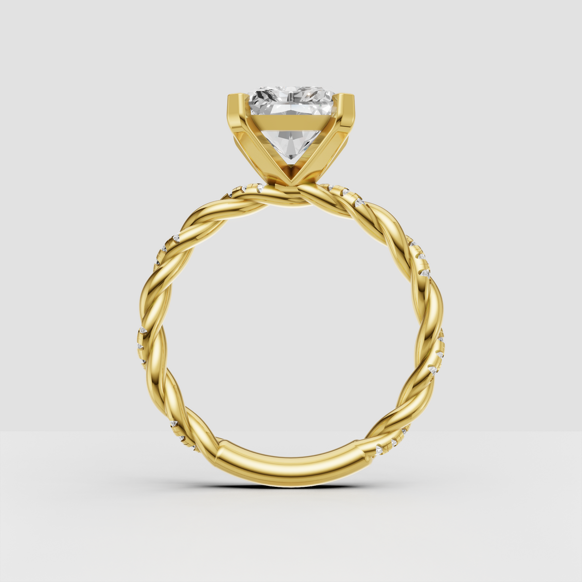 Yellow gold radiant cut diamond ring with pavé shoulders