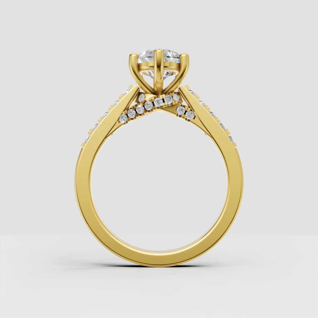 Pear diamond engagement ring in gold with detailed V-shaped split shank