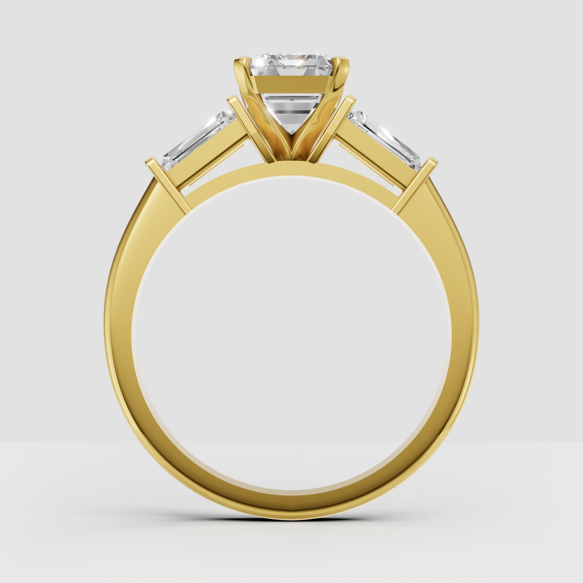 Modern emerald cut diamond engagement ring with tapered gold band
