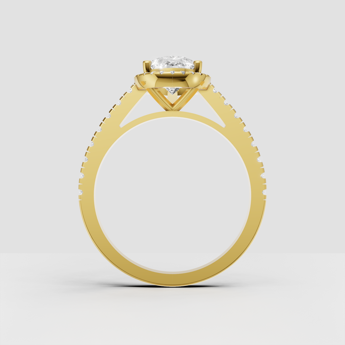Yellow gold pear diamond halo ring with detailed pave band