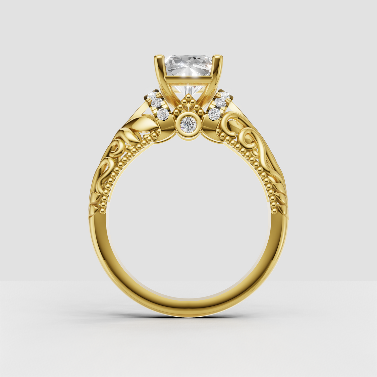 Ornate yellow gold radiant diamond ring with milgrain beading and leaf motifs