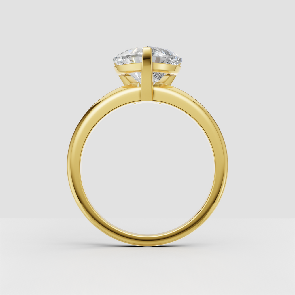 Heart diamond engagement ring featuring a sleek polished gold band