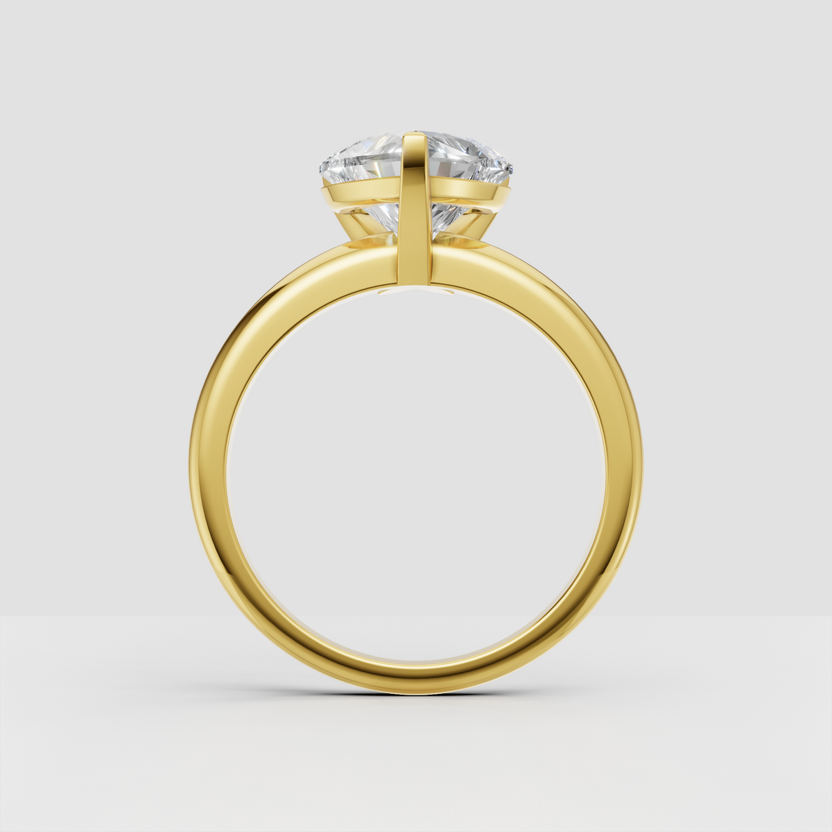 Heart diamond engagement ring featuring a sleek polished gold band