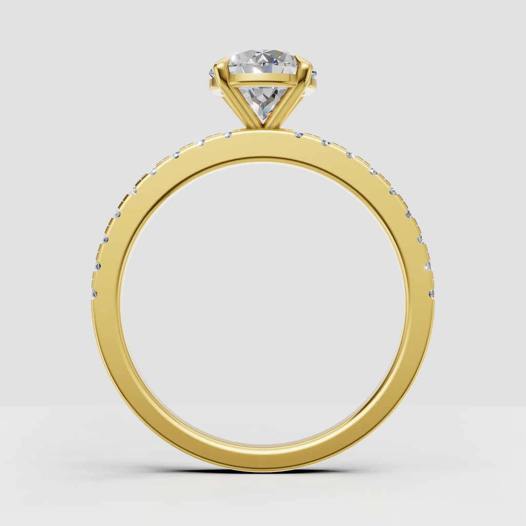 Classic round brilliant Diamond four-prong engagement ring with pavé band