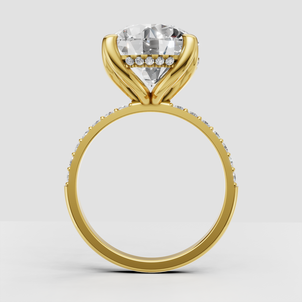 Six-prong round diamond engagement ring with sparkling accent stones