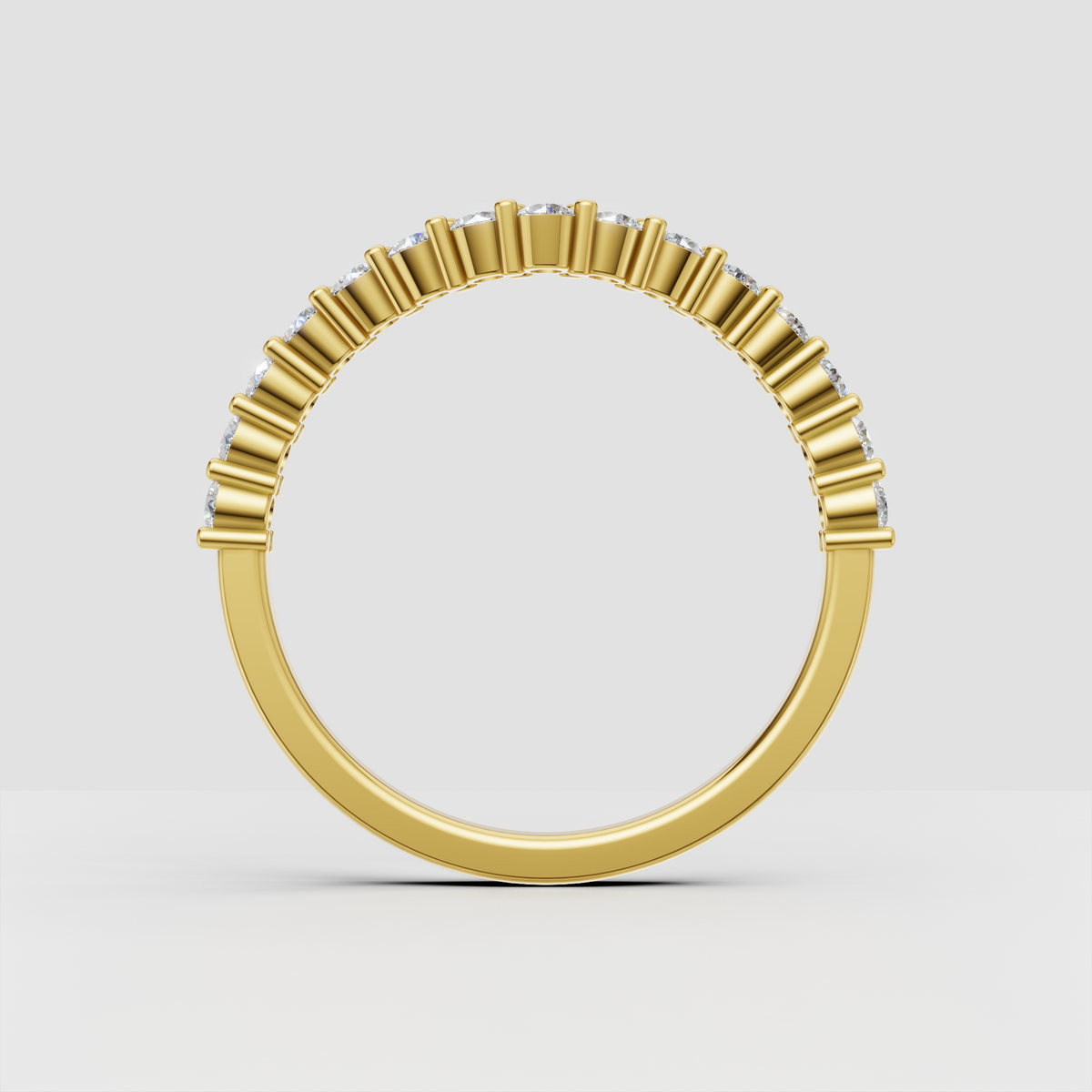 Elegant round diamond shared prong wedding band in yellow gold