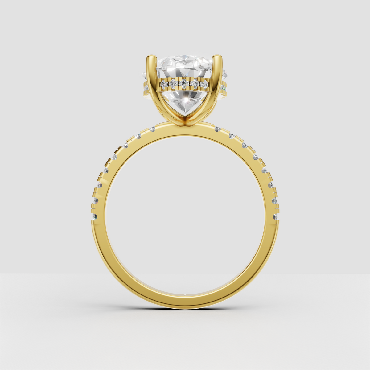 Oval cut engagement ring featuring four prongs and hidden halo