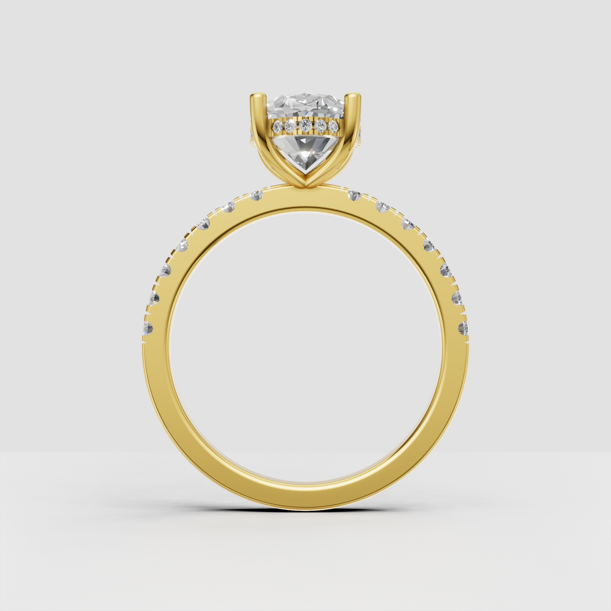 Oval center diamond ring with four prongs and pavé side stones
