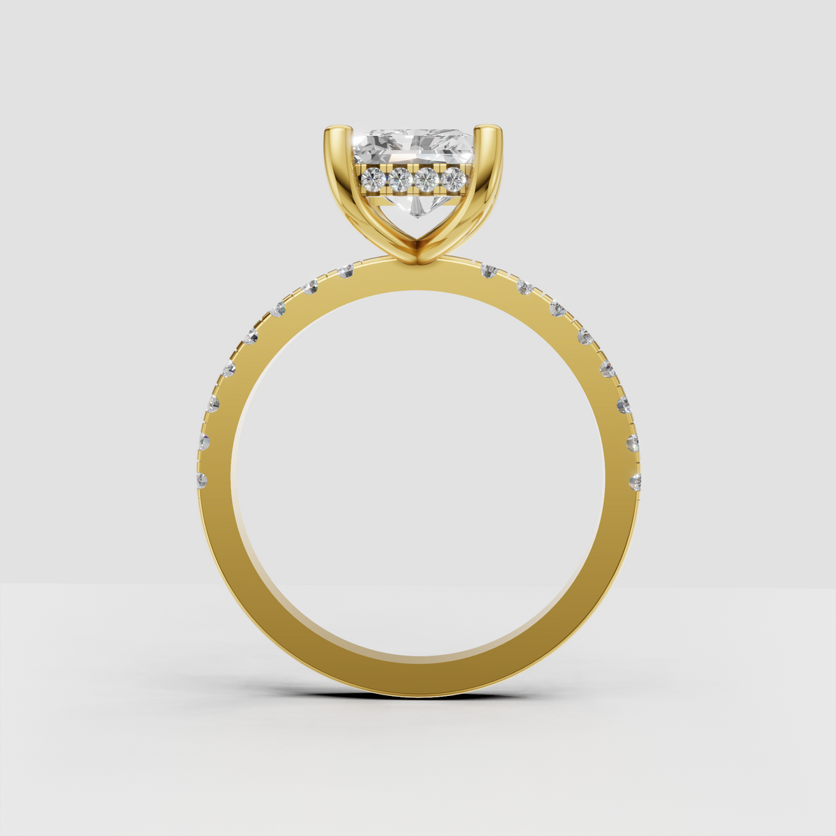 Yellow gold radiant cut engagement ring with concealed halo