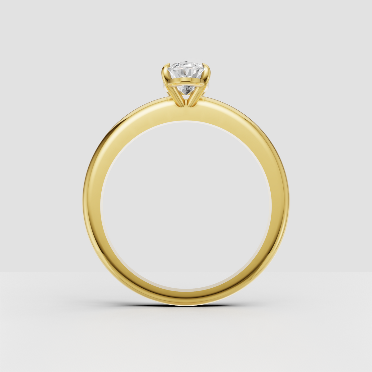 Oval-cut diamond secured in a classic four-prong yellow-gold setting