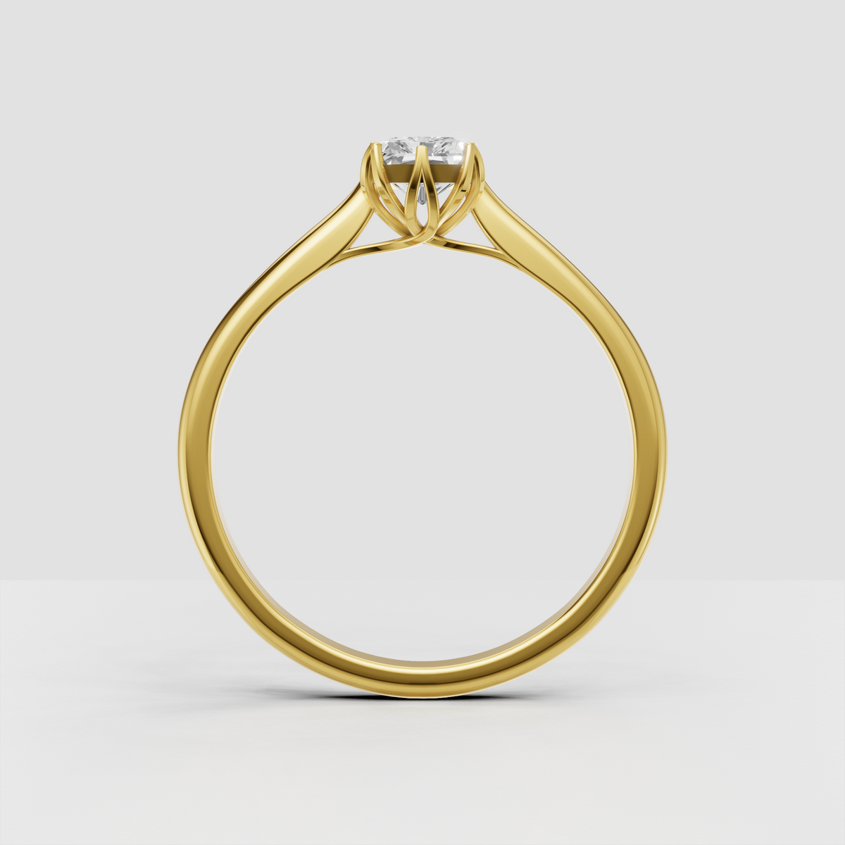 Rectangular radiant cut diamond ring with polished gold band
