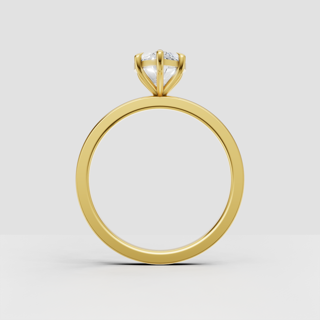 Marquise center stone engagement ring in polished gold setting