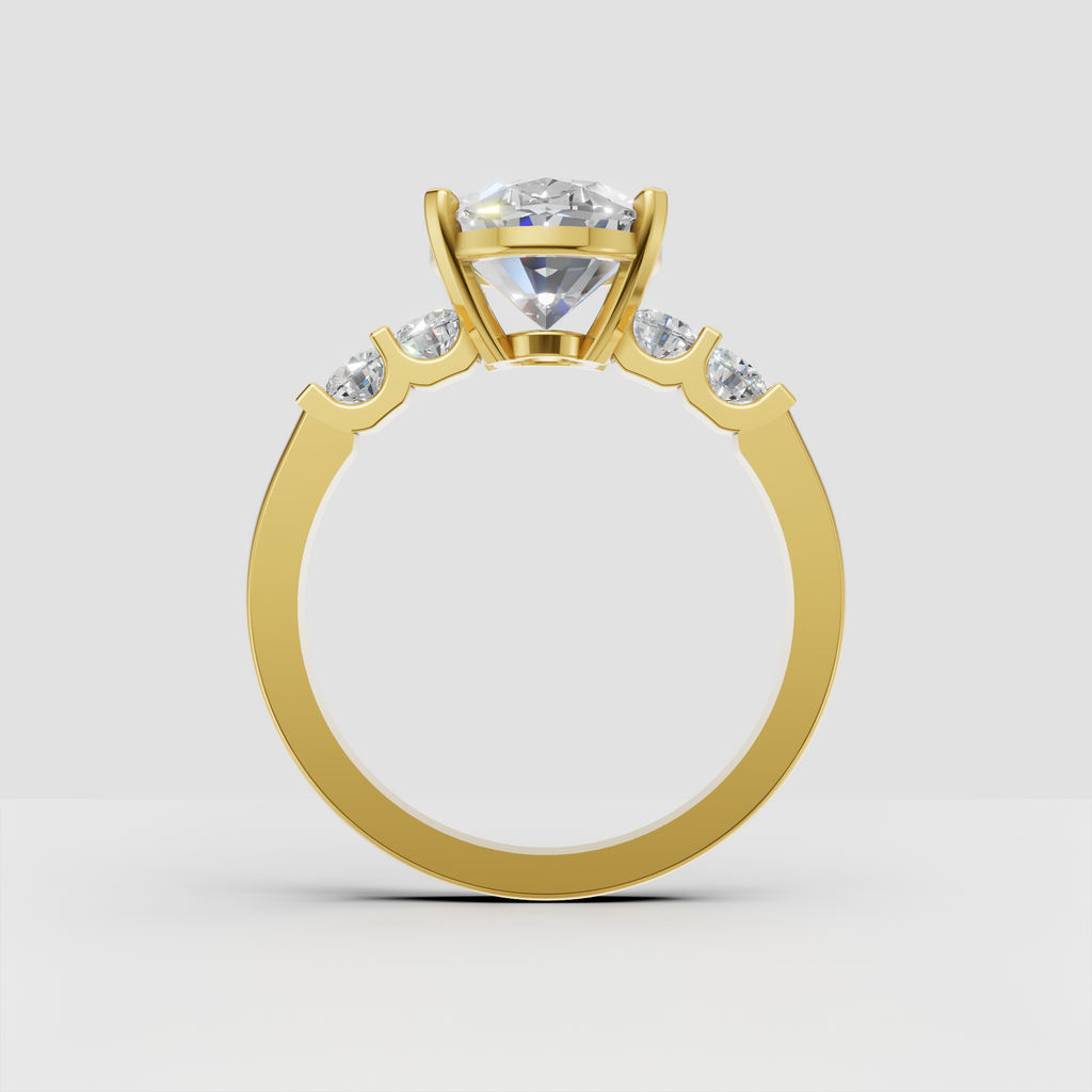Oval center diamond ring with graduated side stones and polished gold band