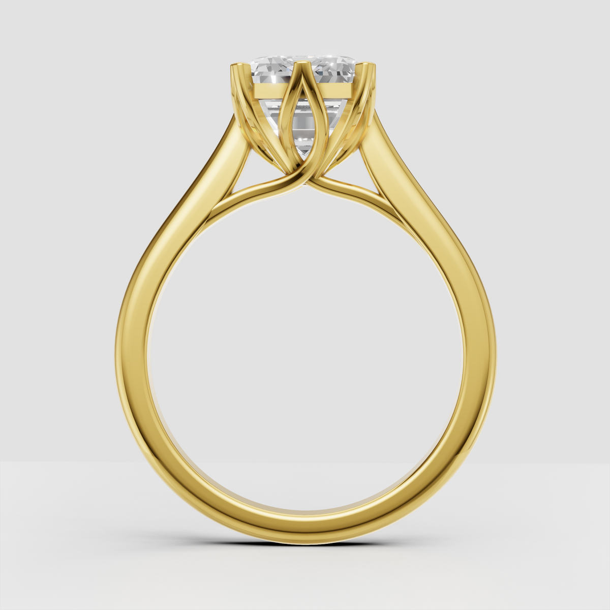 Emerald cut diamond solitaire ring with sculptural crossover band