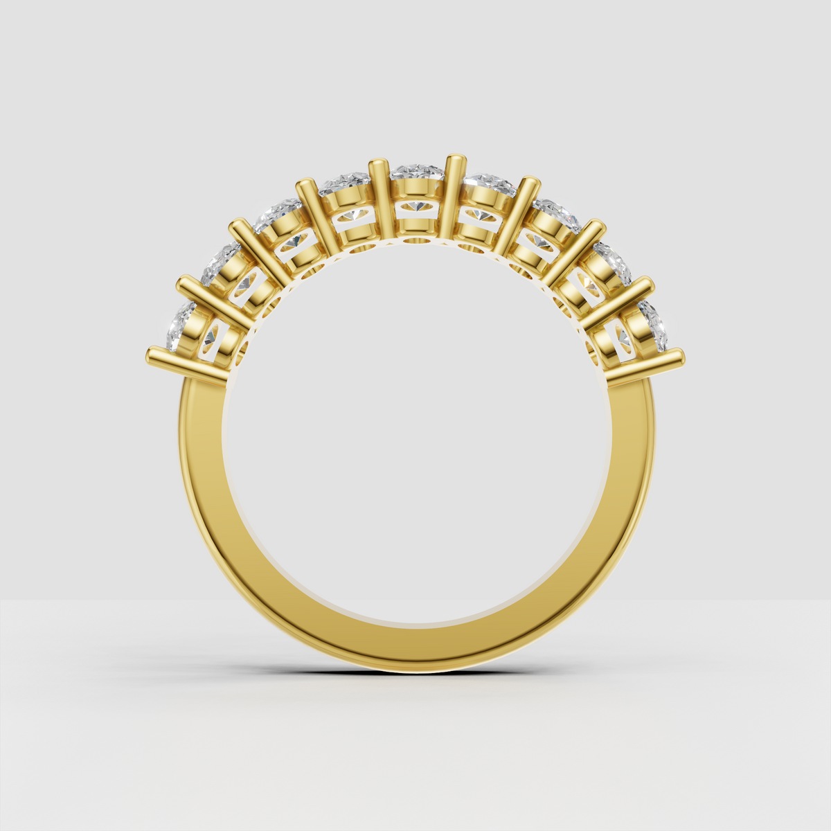Luxury oval diamond eternity ring crafted in polished yellow gold