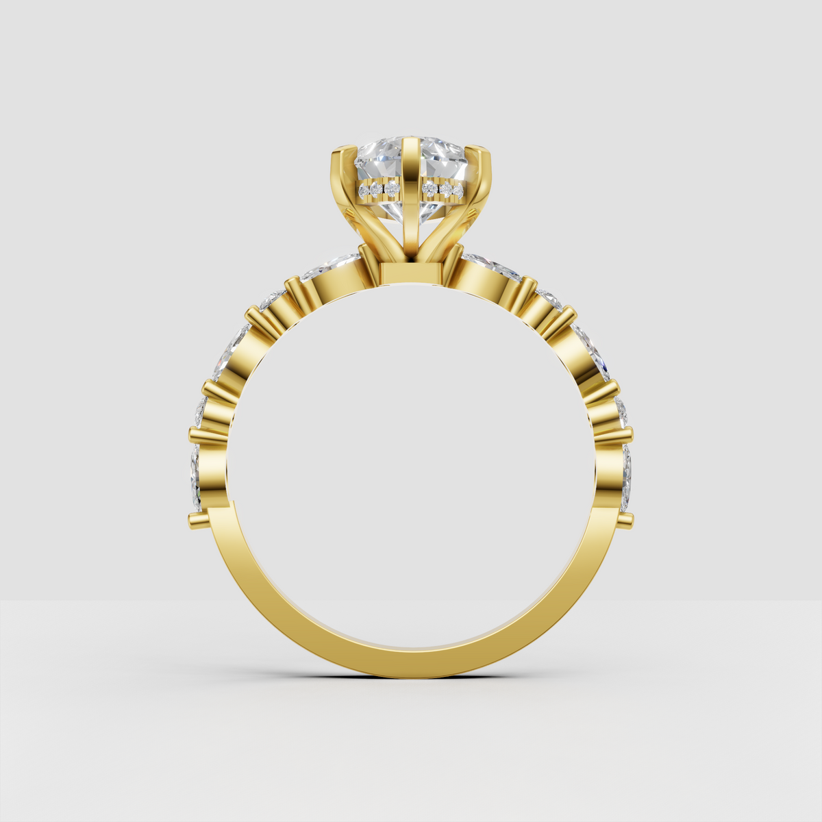 Yellow gold marquise diamond ring with pavé shoulders
