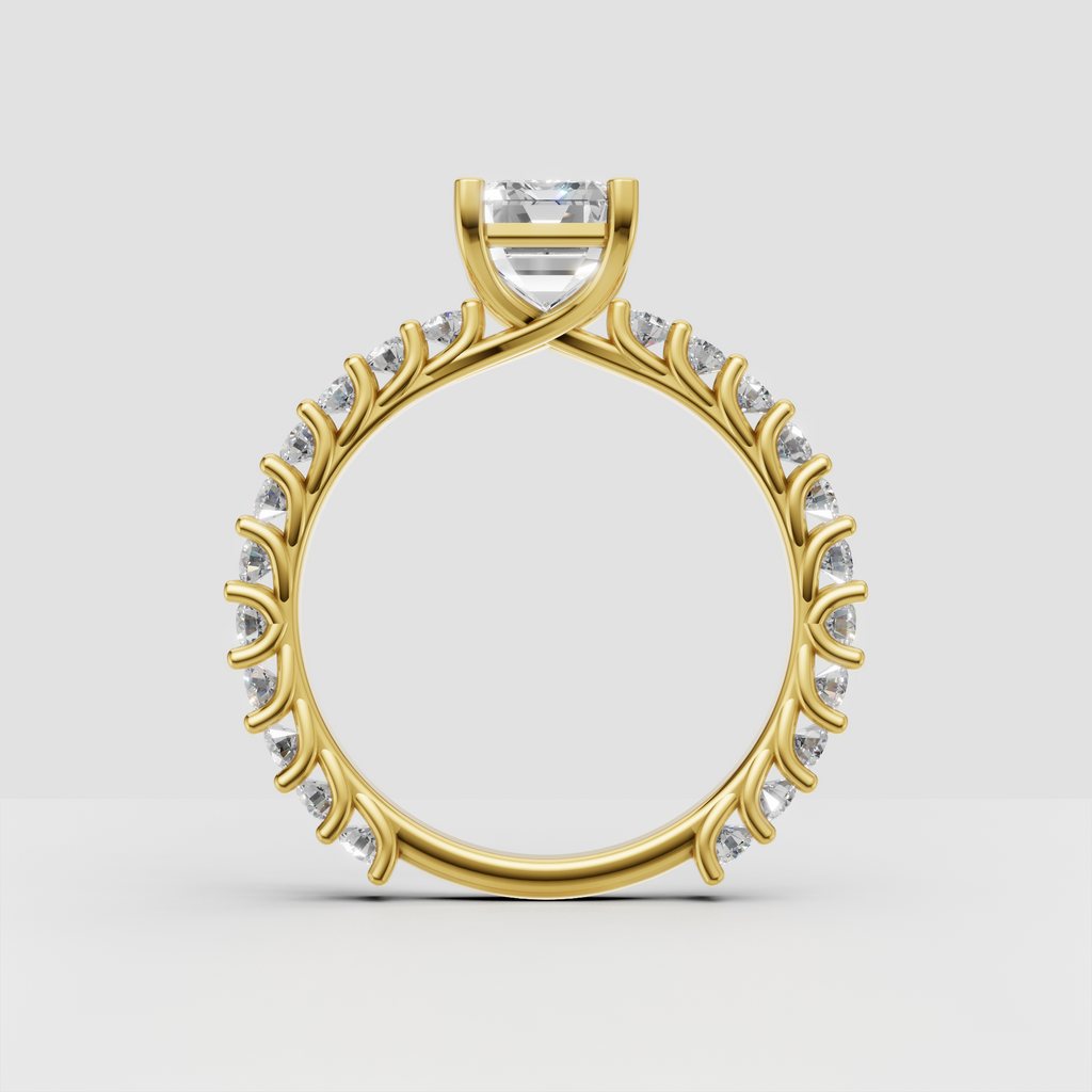 Emerald cut diamond ring with four-prong center setting