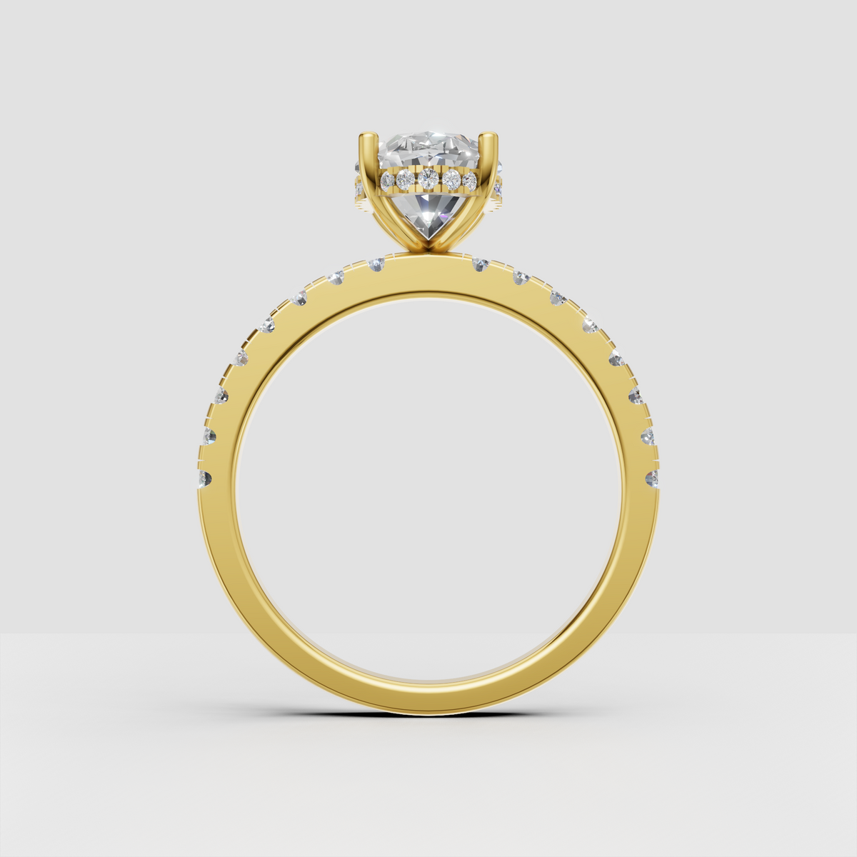 Elegant pear diamond engagement ring with pavé-set round stones along the band