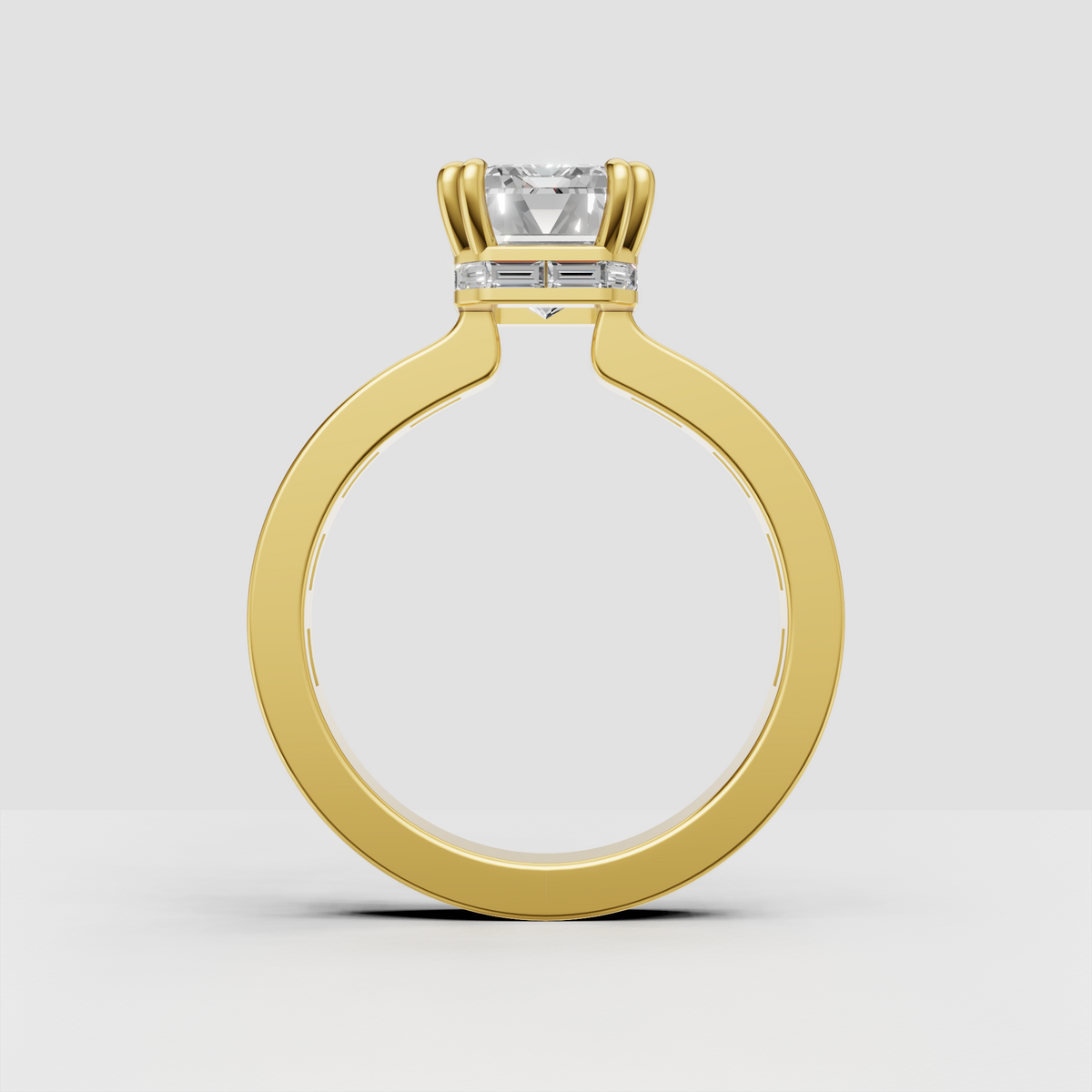 Emerald cut diamond ring with rectangular baguette accent stones along shoulders