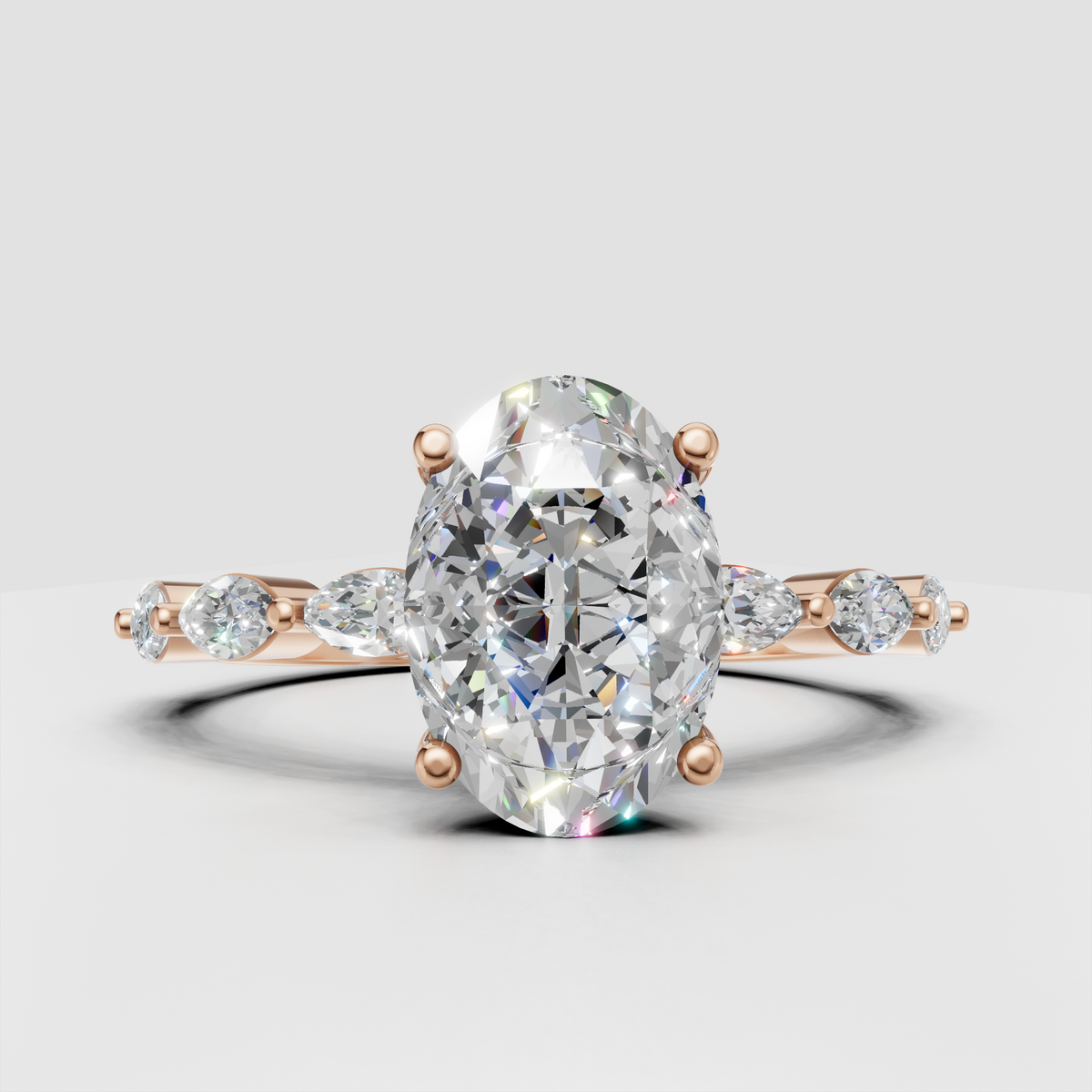 Polished yellow gold ring featuring oval center diamond and side accents