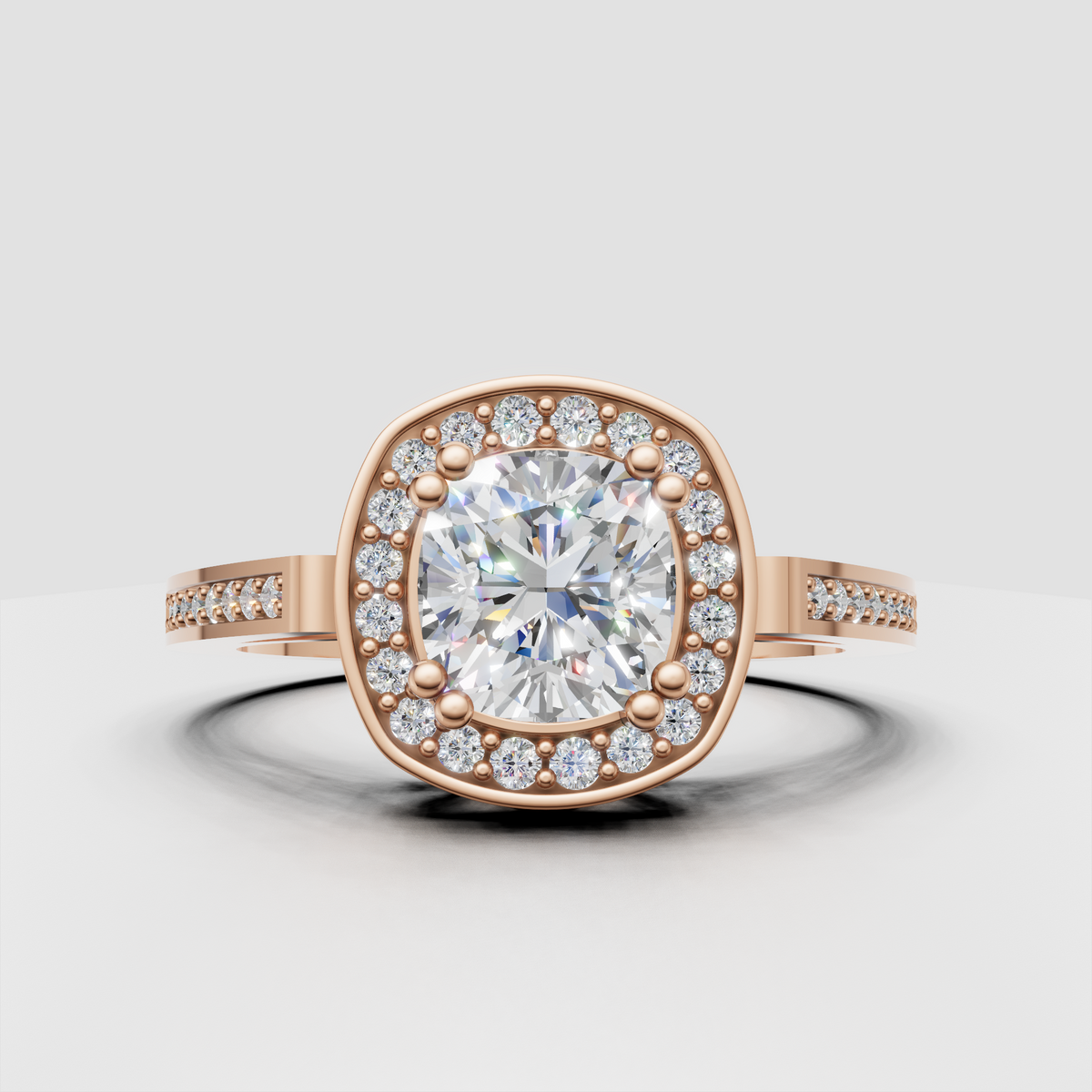 Gold cushion cut engagement ring with round diamond halo