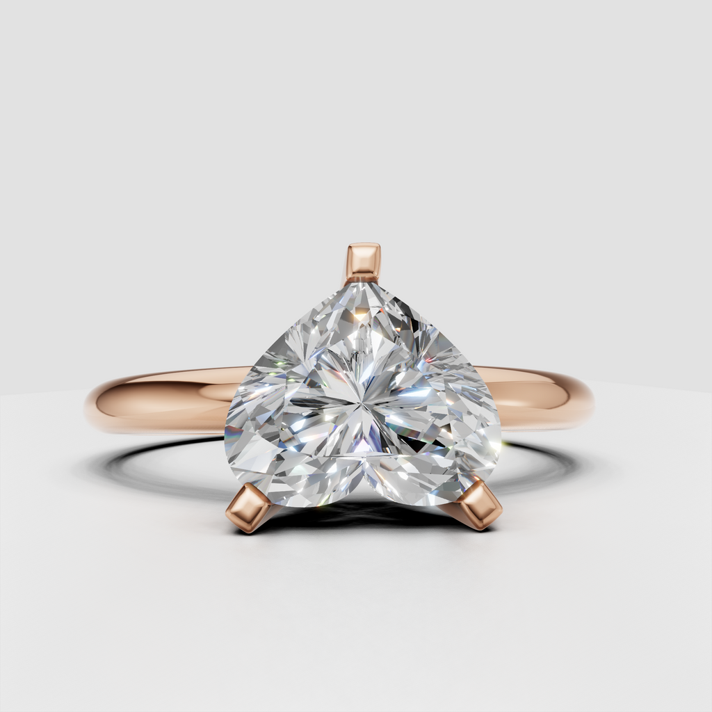 Yellow gold heart diamond ring with open gallery beneath the center stone